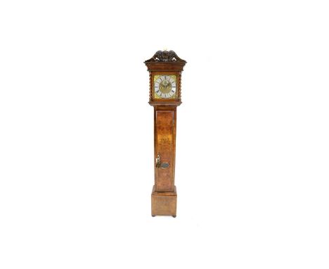 Edward Stanton, London: a burr walnut and walnut longcase clock, the 10in. brass dial with silvered roman chapter ring, matte