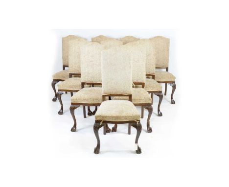 A set of ten Georgian-style mahogany high-back dining chairs, first half 20th Century, the arched backs and stuff-over sets u