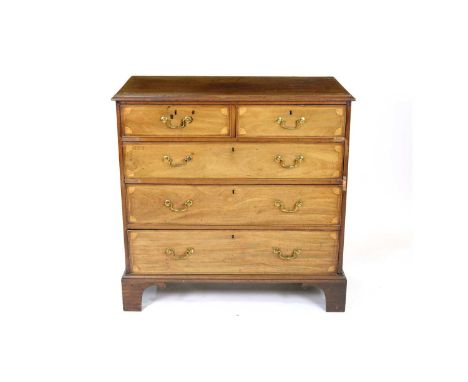 A George III mahogany and fan inlaid chest, the rectangular moulded top above too short and three long graduated drawers each
