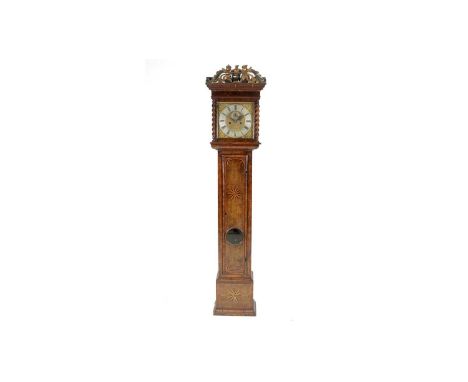 Thomas Meekins, Amesbury: an 18th Century inlaid and oyster veneered walnut longcase clock, the 11in. brass dial with silvere