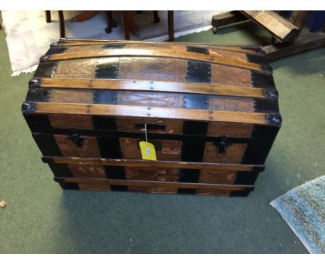 Wooden and leather bound domed trunk