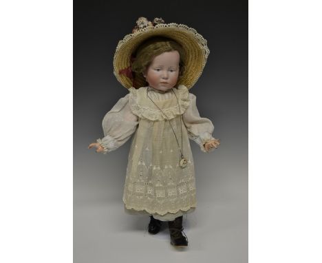 A Kammer & Rheinhardt Marie bisque head and ball jointed bodied composition character doll, blue painted eyes, painted featur