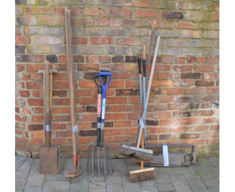 Various garden tools including spades, forks, brooms etc