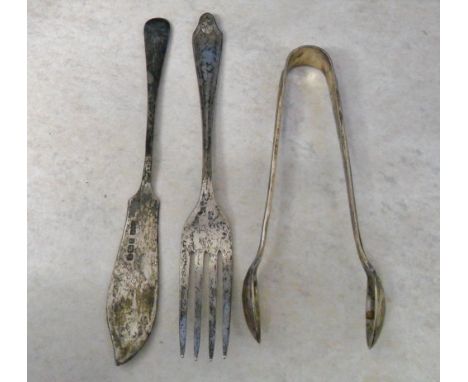Silver sugar bows Sheffield 1921 Maker John Round & Sons & small fish knife and fork Sheffield 1910 & 1931 total weight 1.88 