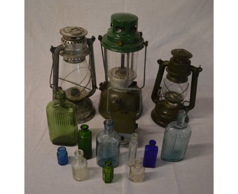 3 lamps, a signal flash lamp and chemists glass bottles
