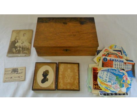Wooden box containing old luggage stickers, cased silhouette, Coronation ticket 1831 etc