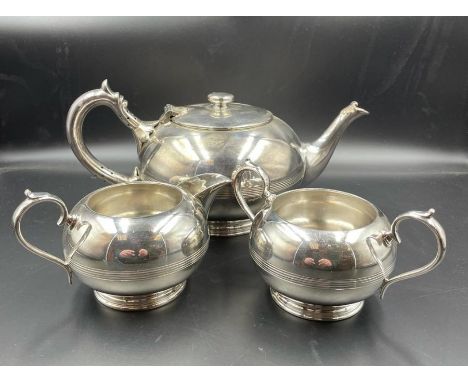 An Art Deco style tea pot, sugar bowl and milk jug 