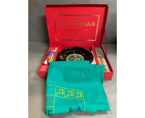 A Vintage Merit Las Vegas Roulette set with additional tokens