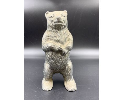 A Vintage cast iron moneybox in the form of a Bear.