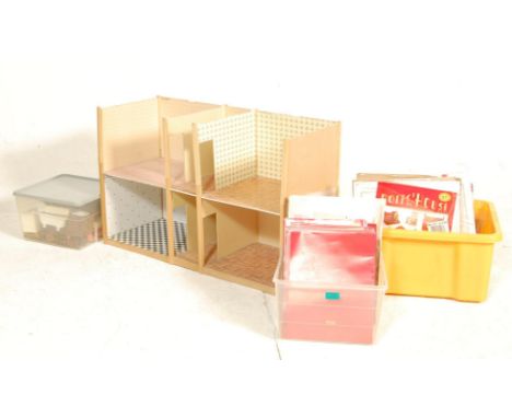 A collection of Del Prado made Doll's House Step By Step magazines, Doll's House furniture, and a part-finished doll's house.