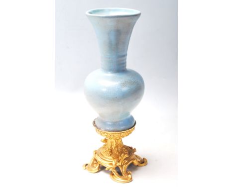 A 18th Century Chinese antique porcelain vase of baluster shape having a light blue / turquoise Celadon Ge glaze with crackle