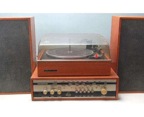 A vintage mid 20th century Marconiphone 4 Unit Four comprising of a teak wood cased turntable with Garrard 2025TC deck and sm