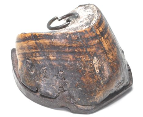 An early 20th Century equestrian interest horses hoof complete with horse shoe having a hanging ring to the top. Measures 9 x