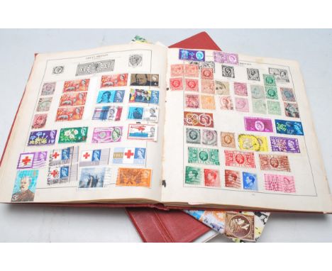 A collection of vintage 20th Century world stamps in red albums dating from the early 20th Century onwards to include Great B