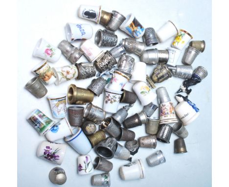 A collection of vintage 20th Century ceramic and with metal thimbles, to include a selection of souvenir examples, decorative