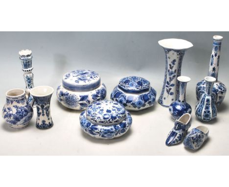 An extensive collection of early 20th century blue and white Delft made in Holland ceramic porcelain items to include candles