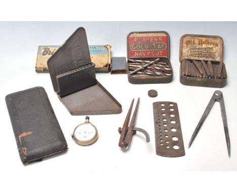 A collection of vintage retro precision woodworking tools to include drill bit stands, metal number and letter serial number 