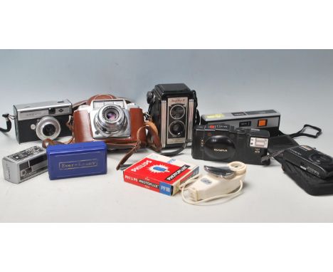 A collection of vintage 20th century cameras to include Parator ISO-Rapid I, Olympus A11, Photo Sport Highlite Tele, Nikon Co