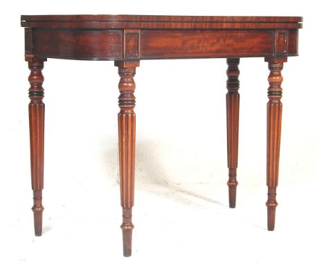 
A 19th century Georgian solid mahogany demi lune / half moon / console card table. Raised on square tapering legs with fitte