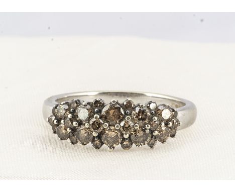 A 14 ct white gold coloured diamond dress ring,  the diamond encrusted top with claw set brilliant cuts, on a tapered shank h