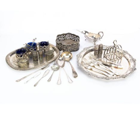 A collection of silver plated items, including a wine bottle coaster, a Sheffield plate salver, various items of flatware and