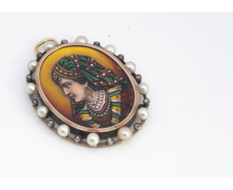 An Indian enamel oval yellow metal pendant, the oval panel with painted profile of a young woman in traditional dress, within