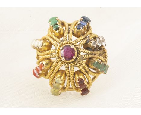 A large Indian basket ring, set with multiple coloured gemstones, including coral, pearl, turquoise, sapphire, emerald and ga