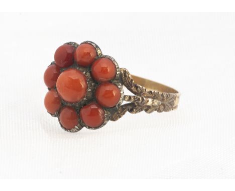 A 19th century coral cluster ring, the silver mount, on a triple engraved floral shoulder, ring size N, 1.3 cm diameter, in a