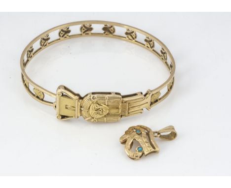 An Egyptian yellow metal bangle, of pierced shape, with various motifs, 6.5cm x 5.5cm, together with an Egyptian yellow metal