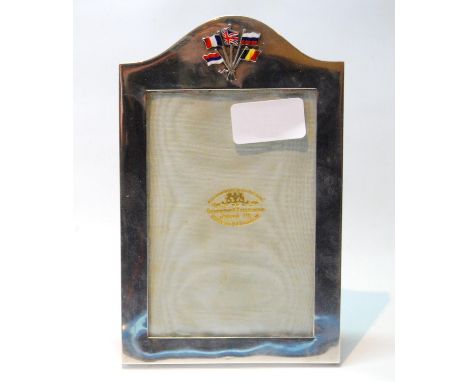 Silver plain photograph frame with arched top and applied enamel flags of the Great War Allies, by The Goldsmiths & Silversmi