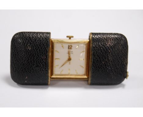 Vintage Swiss manual-winding travelling clock by Voga, the square clock with baton and Arabic numerals, radium hands and a ch