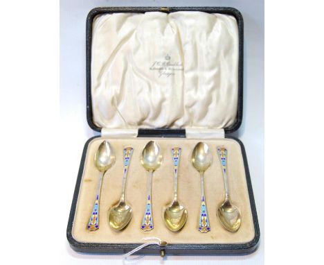 Set of six silver gilt coffee spoons with polychrome enamel of Art Deco style, Birmingham 1928, cased.CONDITION REPORT: All i