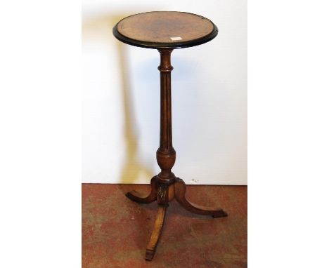 19th century French-style walnut and kingwood wine table, the circular top with an ebonised border, on fluted column and trip