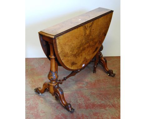 Victorian burr walnut Sutherland table, the drop leaf top on turned supports and baluster columns, with scroll feet and ceram