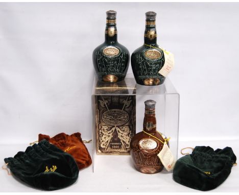 Three bottles of Royal Salute 21 year old blended Scotch whisky, in Spode emerald and brown-coloured decanters with stoppers,