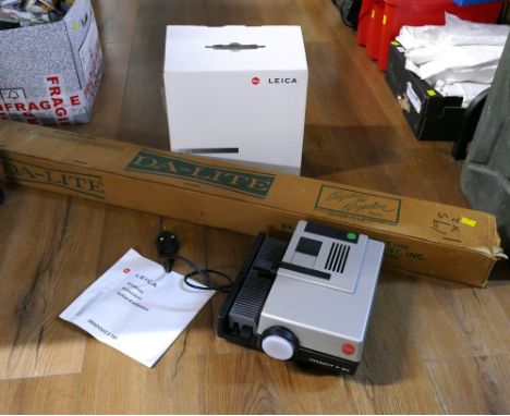 Boxed Leica projector Model P150 and a vintage projector screen 