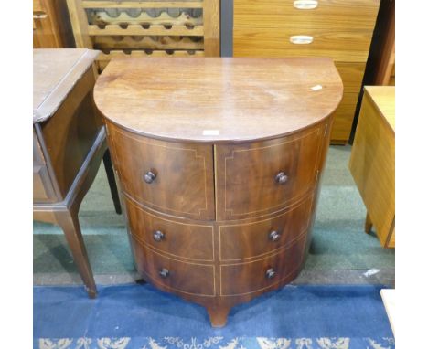 Commode housed in a bow fronted faux chest of drawers  