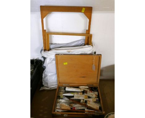 Folding artists easel and wooden box of vintage oil paints