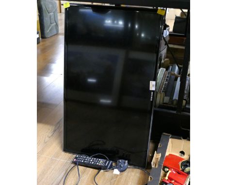 Samsung 27" TV with wall mounted bracket and remote control