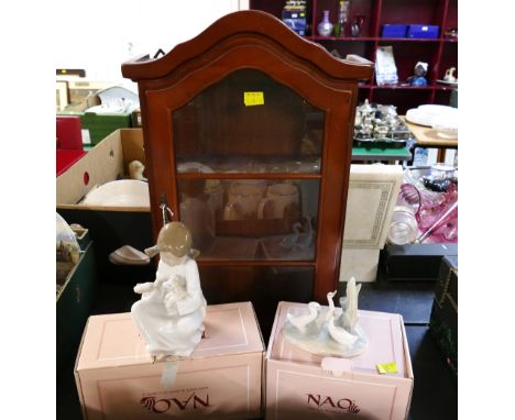 Wooden display cabinet and two boxed Nao figurines