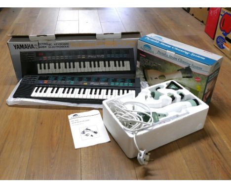 Boxed Yamaha PSS170 keyboard and a portable steam cleaning system 