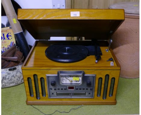 Traditional style electric record player, radio, CD player