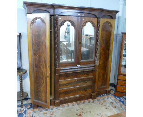 Victorian mahogany veneered breakfront wardrobe with mirrored doors and barley twist supports 