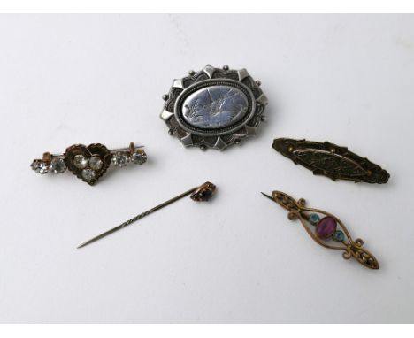 Three yellow metal scarf brooches, stick pin and a white metal bird decorated brooch 