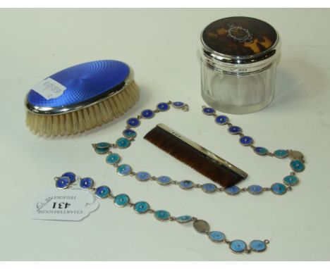 A silver coloured metal and enamel necklace, of blue enamel discs, a matching bracelet, a silver and enamel brush and comb se