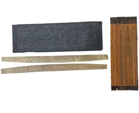A Burmese manuscript in white ink to black painted stock, with rough sketch of a temple / building to verso, together with a 