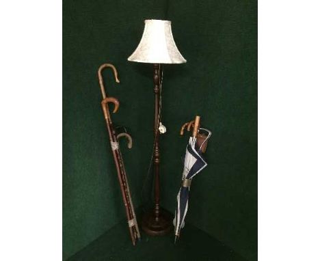 Two bundles of walking sticks, shooting stick, standard lamp with shade