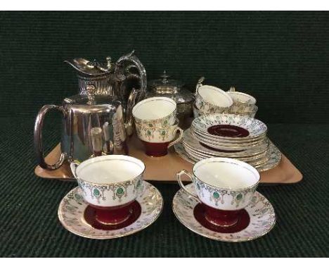 A tray of Windsor bone china tea service, together with four silver plated teapots