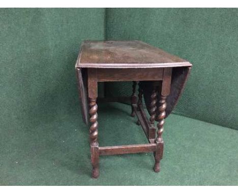 An oak barley twist gate leg table 