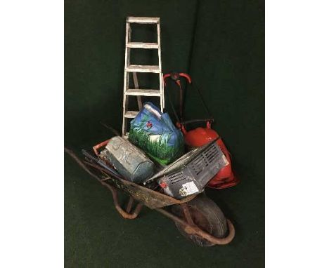 A Flymo hover compact mower, two pairs of steps, wheel barrow, tools, pick axe, etc 